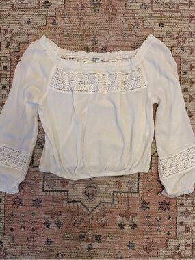 Subdued Off-the-Shoulder White Top with lace trim